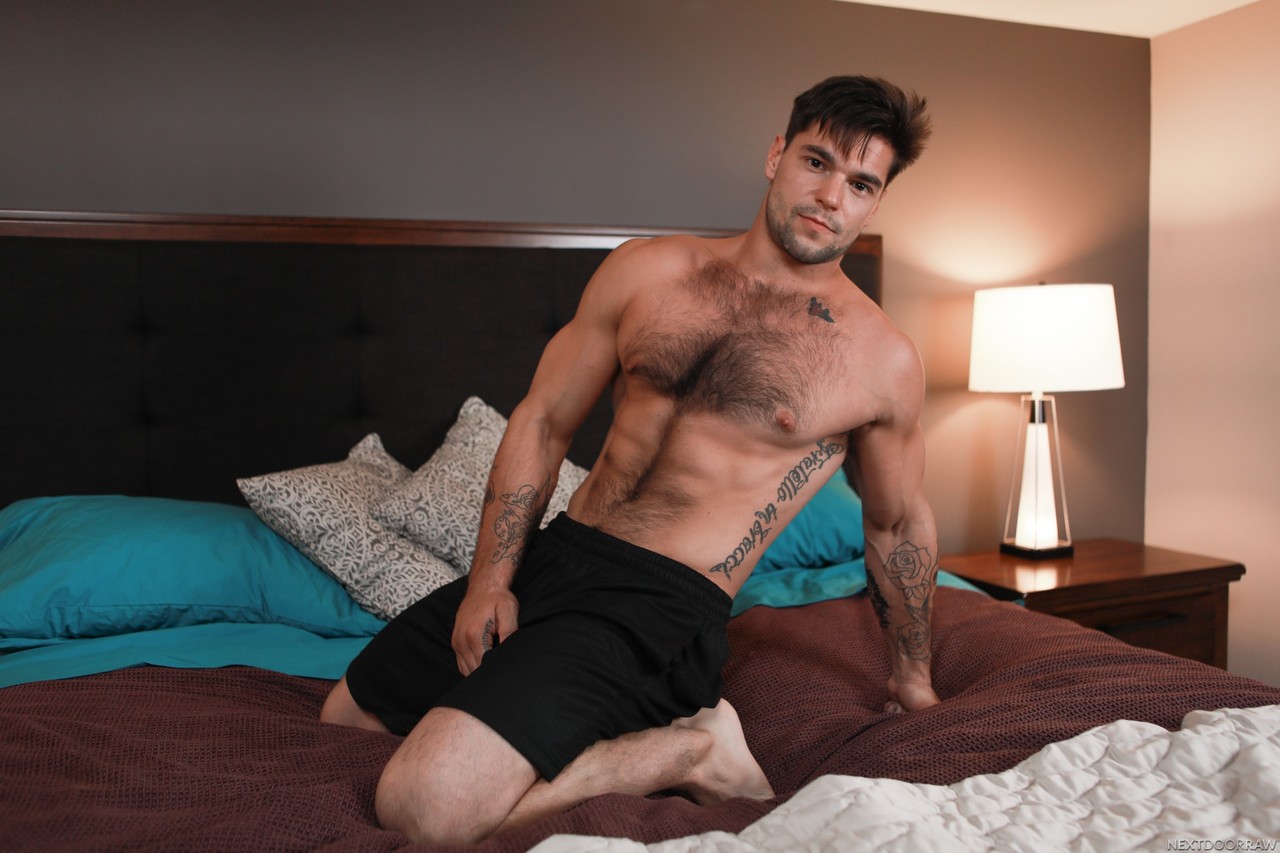Hot gay Aspen fucks horny bear Leeroy Jones on a bed after stripping  
