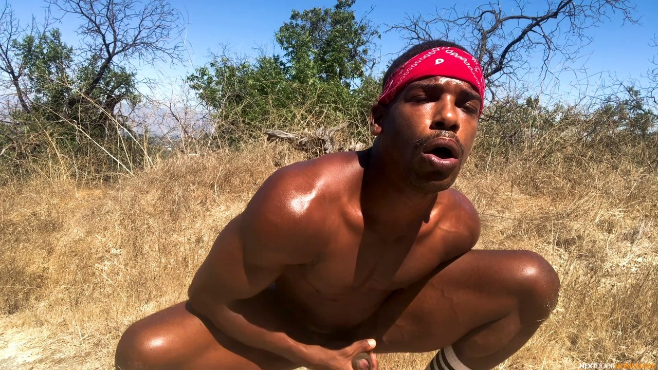 Stunning black gay Adrian Hart flaunts his huge prick and hot muscles outdoors  