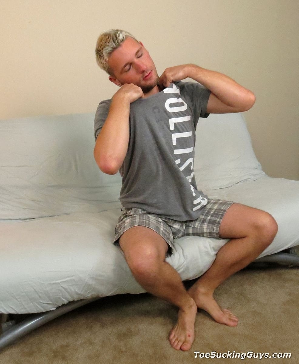 Blonde stud Jason Lee massages his sexy feet and cums on them on the sofa  