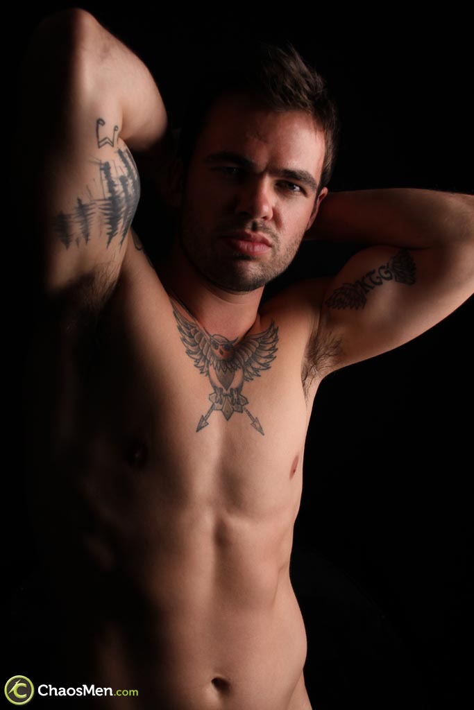 Tattooed gay hunk Carver shows off his athletic naked body & his hard dick  