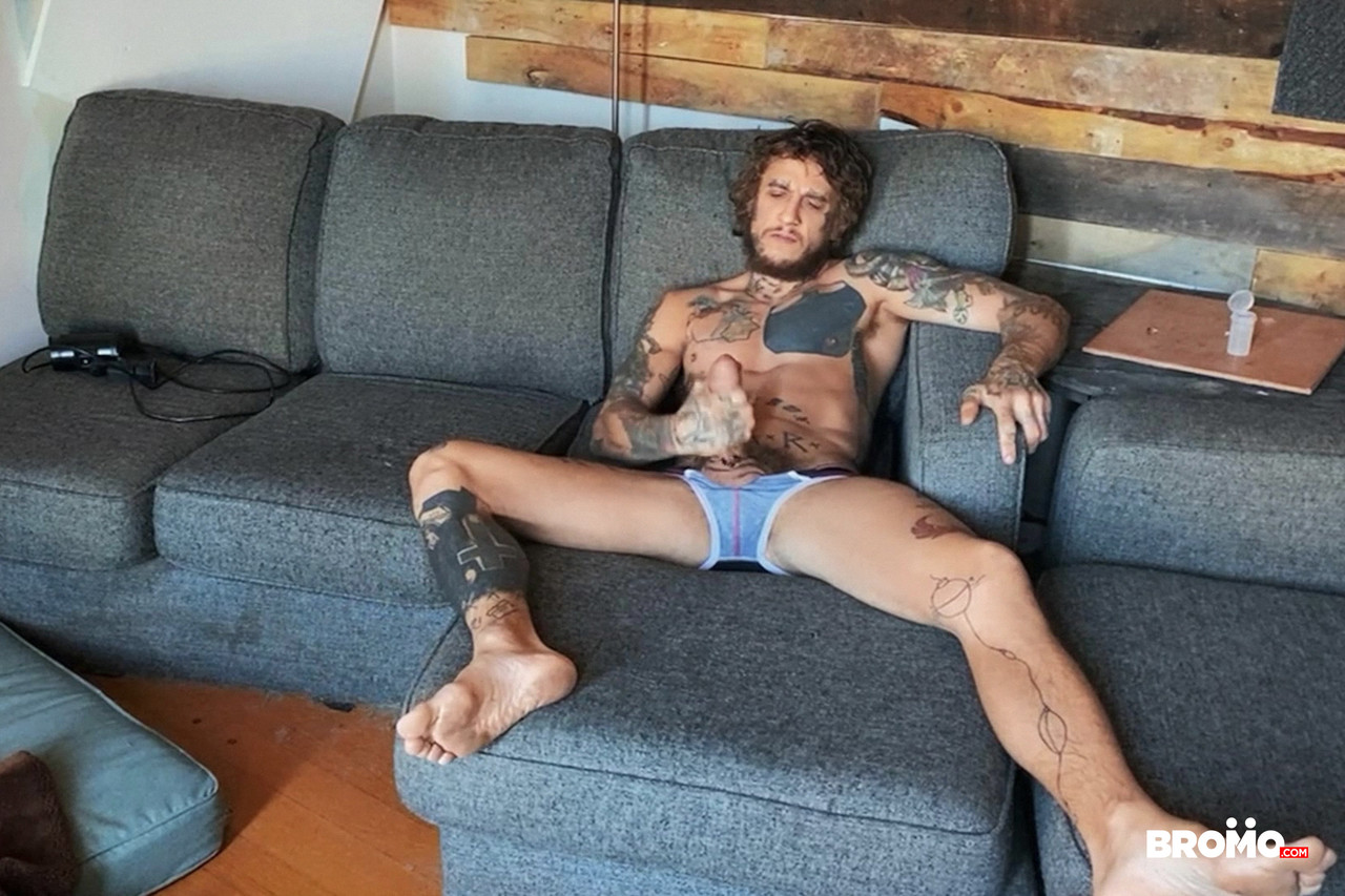 Tattooed gay nympho Bo Sinn strokes his dick & toys his ass at the same time  