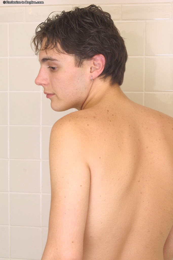 Cute gay teen Owen strips and grabs his boner to masturbate in the tub  