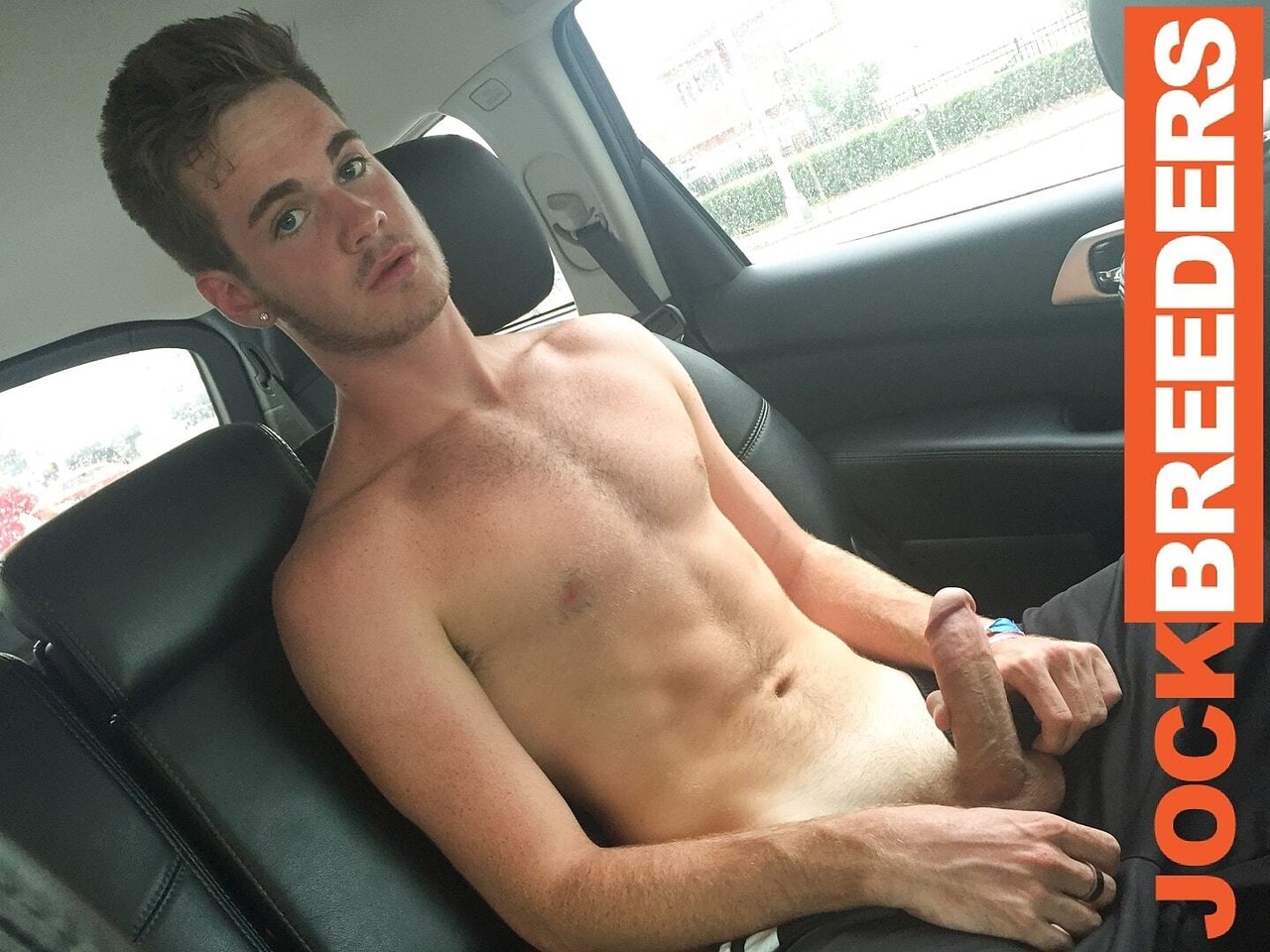 Horny gay stud Benji Banks stripping and masturbating in the cab  