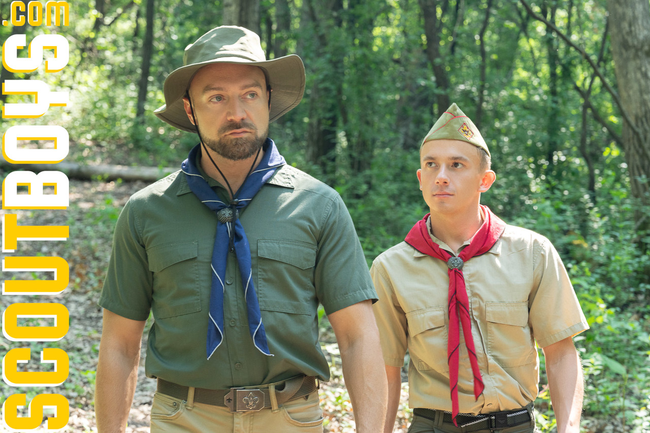 Mature scoutmaster Banner and young scout Zack pose in their sexy uniforms  